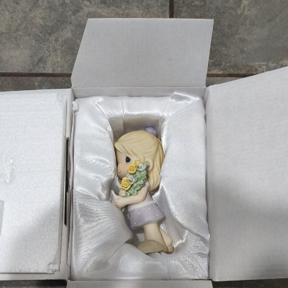 Precious Moments Figurine with Yellow and Lavender Accents